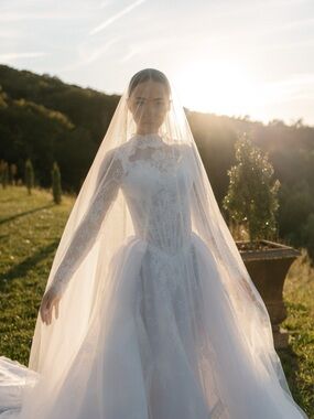Elegant Long-Sleeve Lace Bridal Gown in White